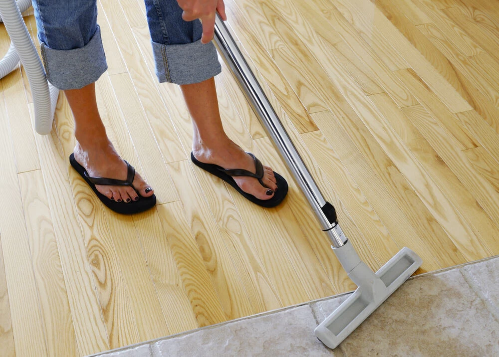 A vacuum cleaner on a hardwood floor